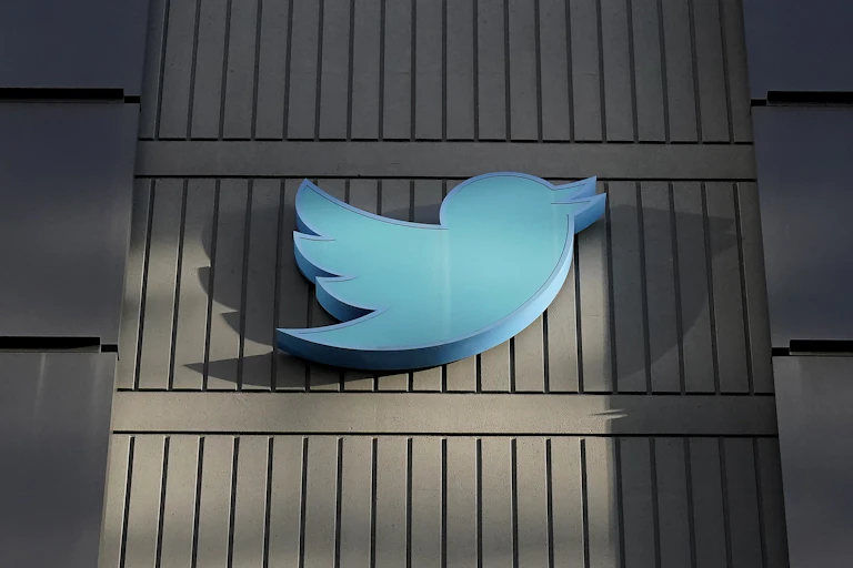 A large cartoonish representation of a bluebird on the side of a building