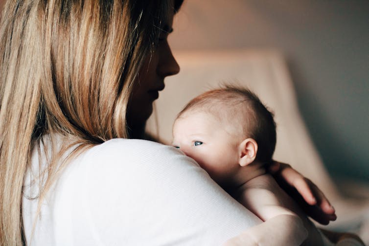 Baby on mother's shoulder