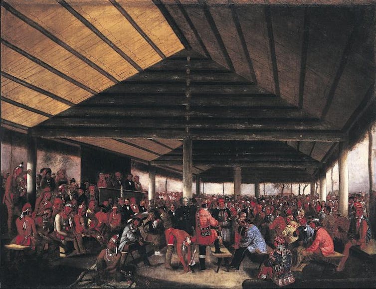 An oil on canvas painting of a meeting of hundreds of 19th century Native American tribe members.
