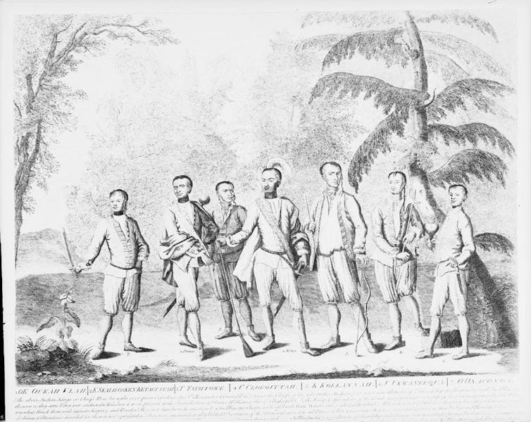 A black and white engraving of 18th century Native Americans in foreground, outside and surrounded by flora.