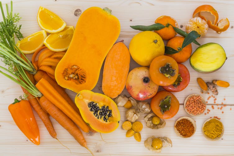 Orange fruits and veggies.