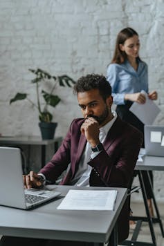 Man at desk thinking