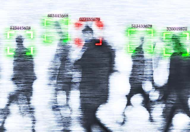 Blurry images of people being viewed through facial recognition cameras