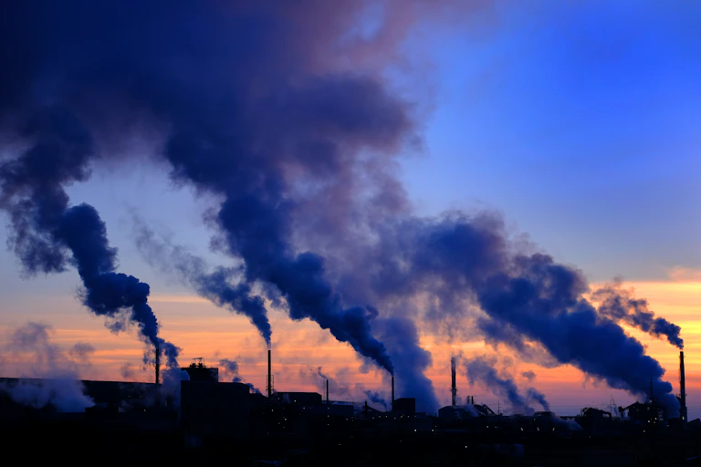 Smoke rising from numerous industrial chimneys