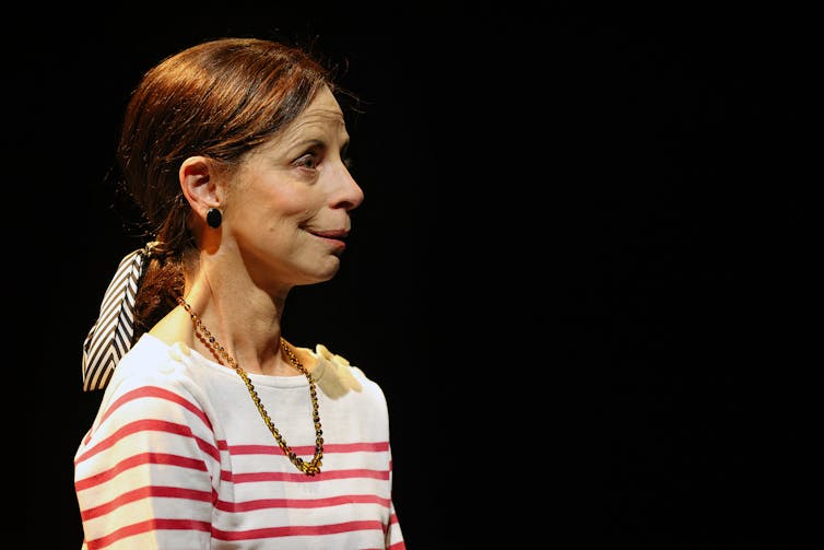Heather Mitchell in a red and white shirt.