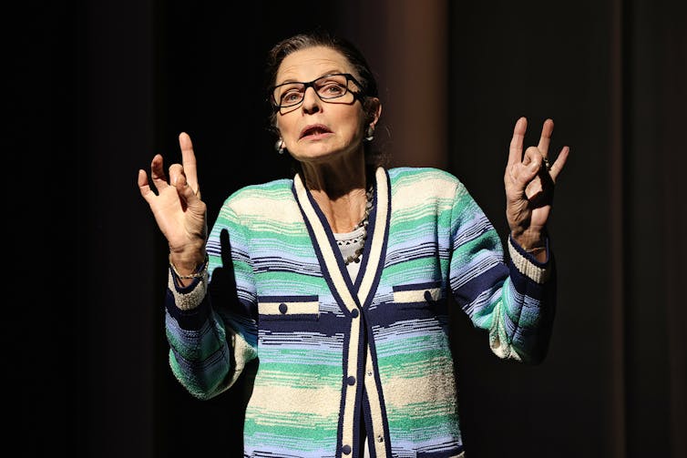 Heather Mitchell in a cardigan