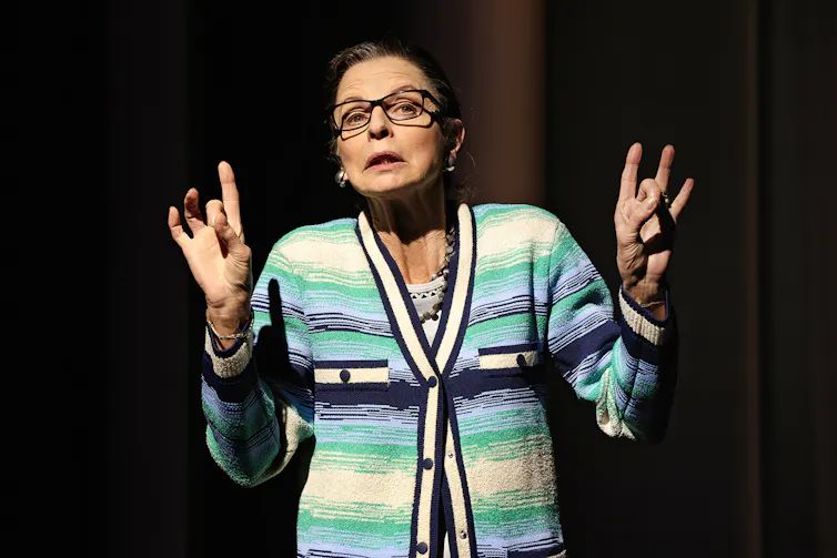 Heather Mitchell in a cardigan