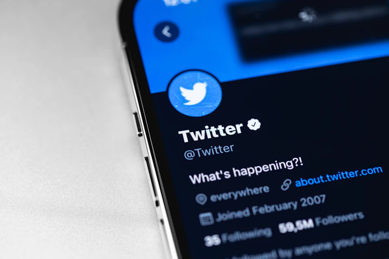 Phone showing Twitter account.
