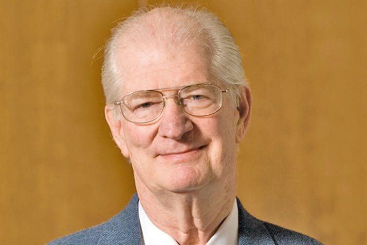 Headshot photo of Daly as an older man, with glasses and thinning hair,