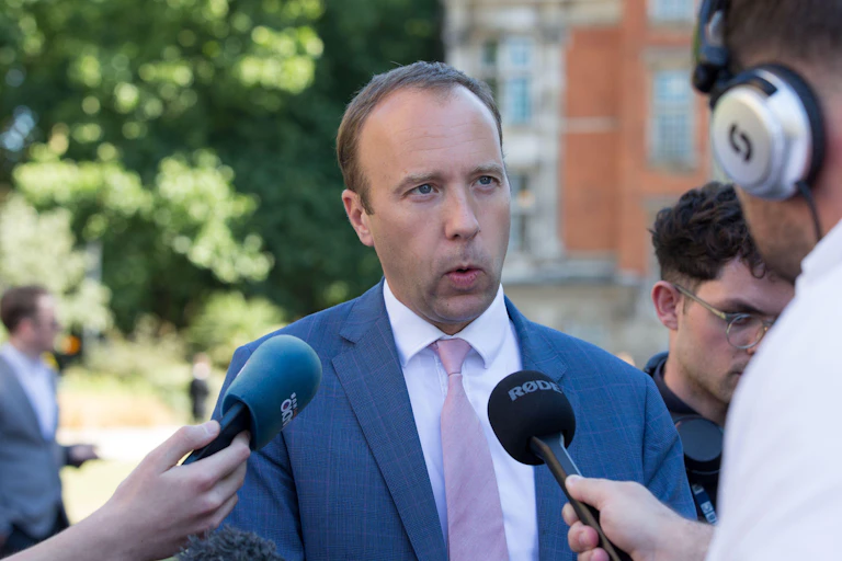 Matt Hancock briefing the press
