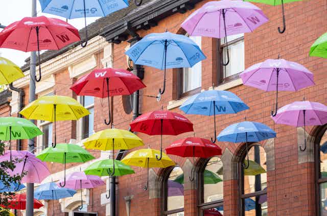 colourful umbrellas suspended above street