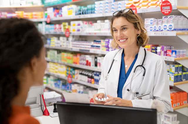 pharmacist behind counter