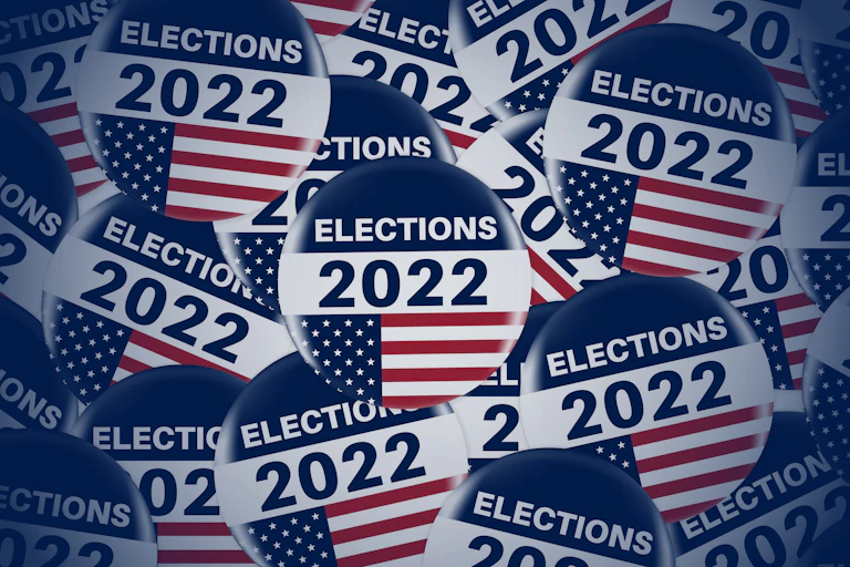 Circle pins or badge with US flag.