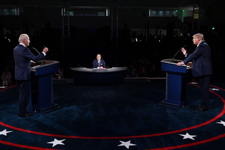 US presidential TV debate with candidates either side of interviewer