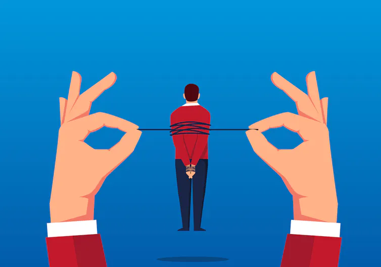 Man tied up by hands.