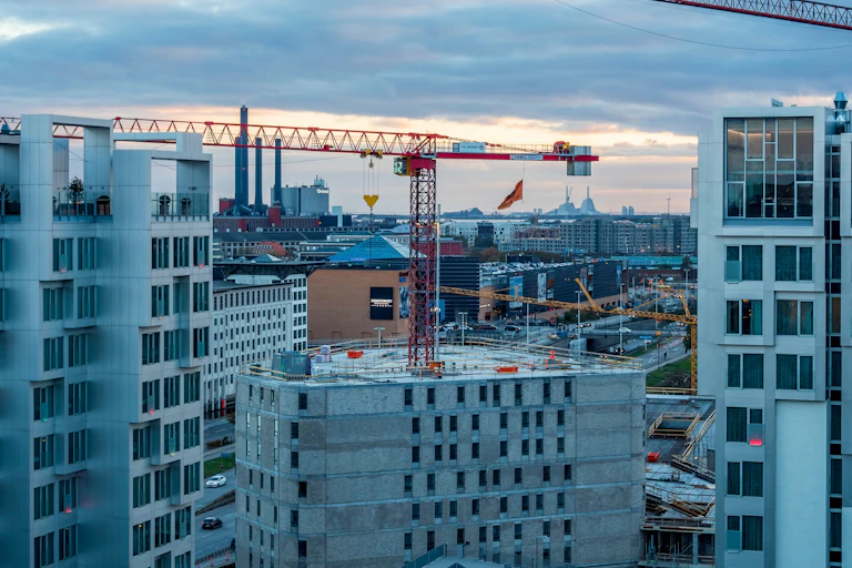 cranes on a building being constructed in the city centre