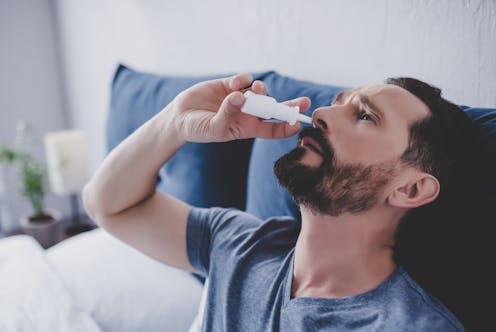 COVID nasal sprays may one day prevent and treat infection. Here's where the science is up to