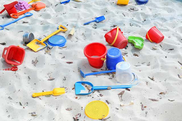 Sandpit with buckets and spades. 