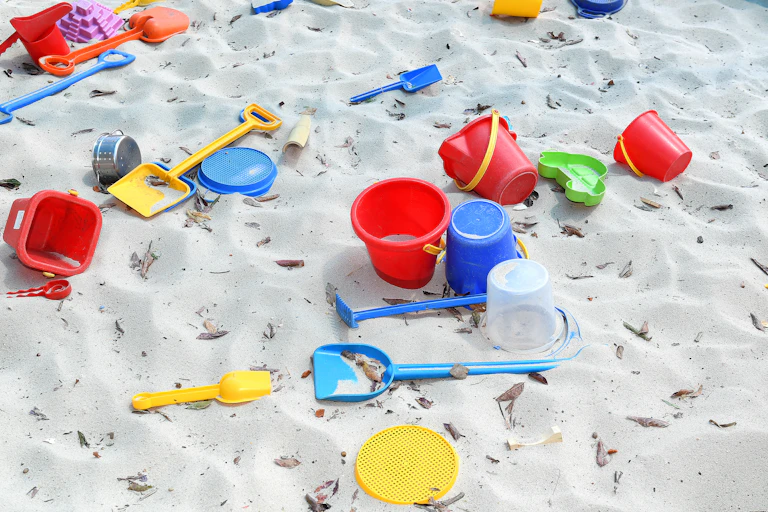 Sandpit with buckets and spades.