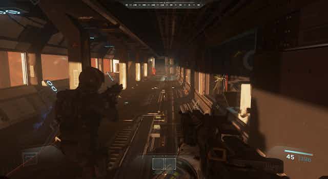 PS4 screen still from Call of Duty, showing gunmen walking along a dark corridor