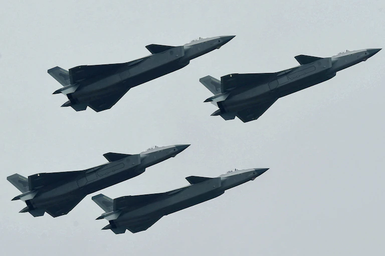 Four Chinese fighter jets flying in formation