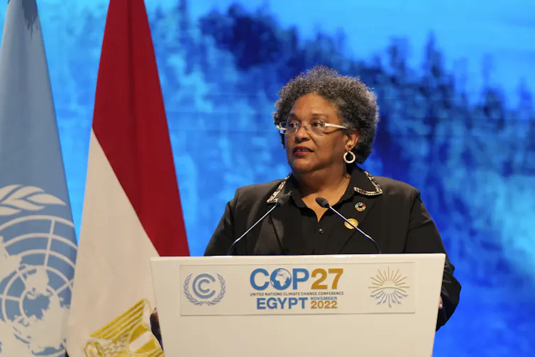 Mia Mottley behind a COP27 podium