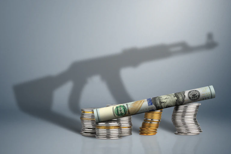 money with gun shadow