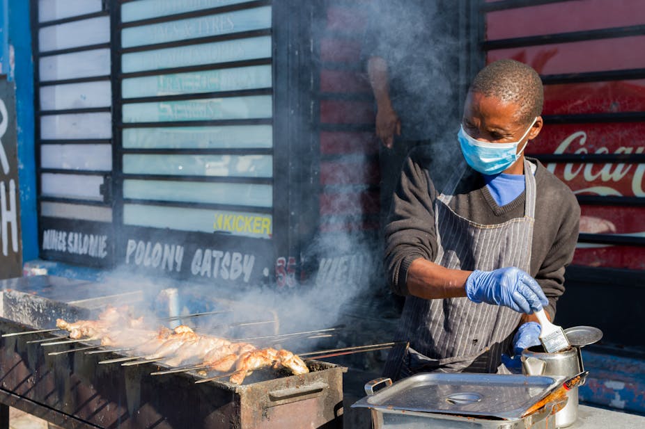 a street vendor making food