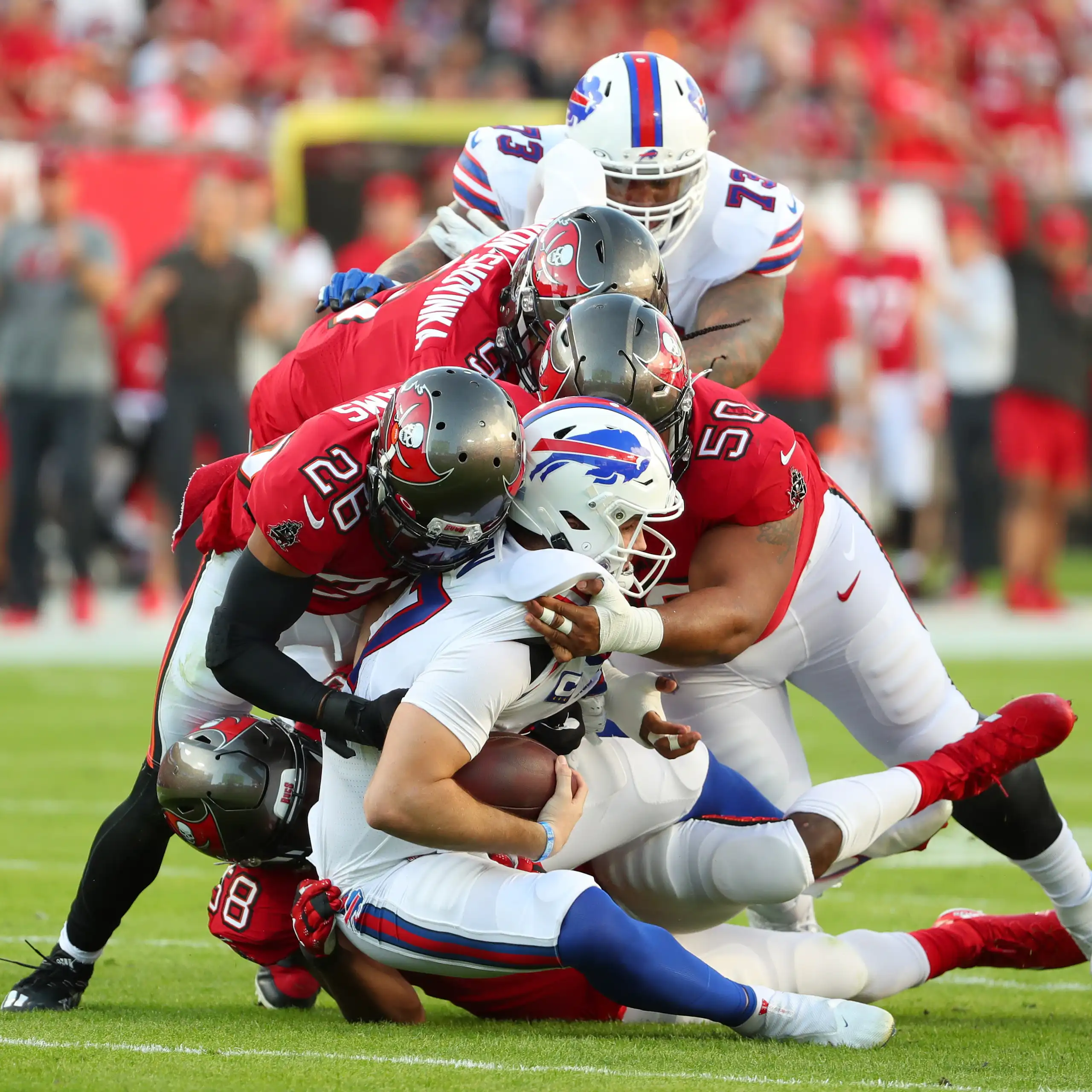 American football players collide on the pitch.