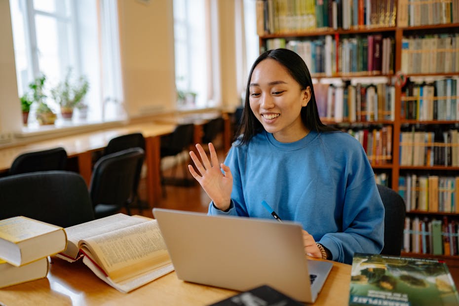 A student sitting at a laptop.