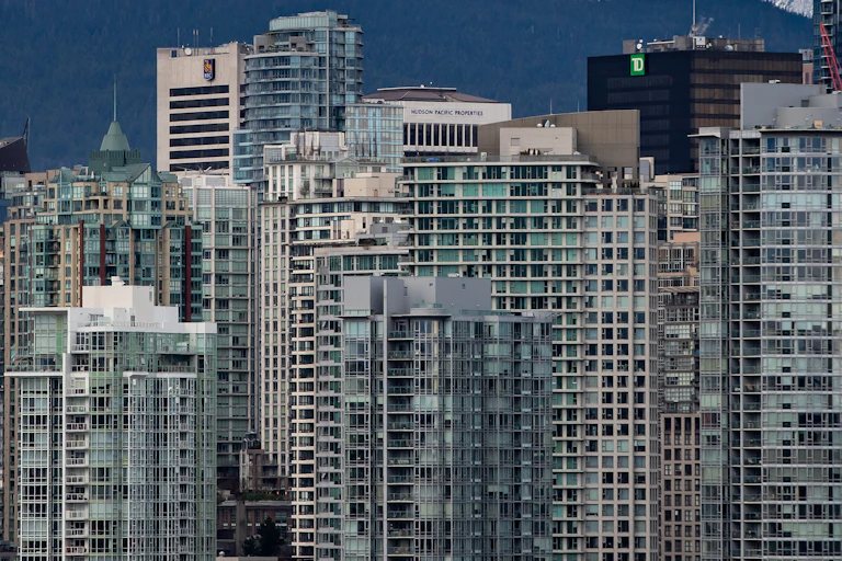 A row of densely packed urban condo towers