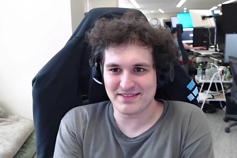 Sam Bankman-Fried sitting at a computer