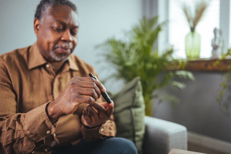 Man checking blood sugar