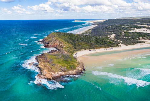 At least 700,000 years ago, the world's largest sand island emerged as the barrier that helped the Great Barrier Reef form