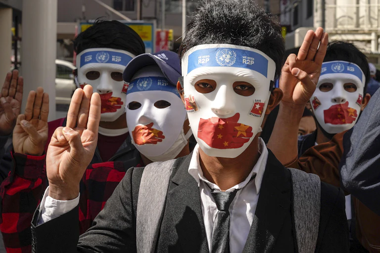 Myanmar's people liMyanmar democracy activists protest against the military coup and China's support for the junta, in Tokyo, 11 April 2021.