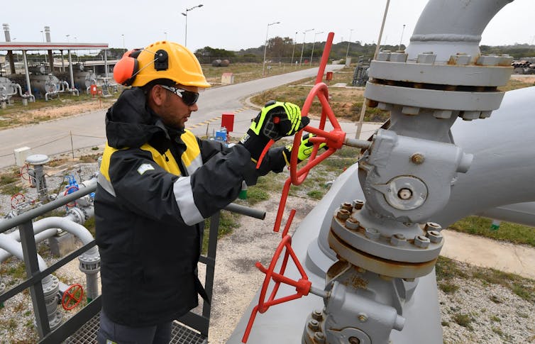 A worker at a pipeline in Tunisia that supplies natural gas from Algeria to Italy. 