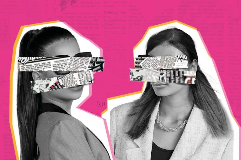 Two women with their eyes covered by newspaper.