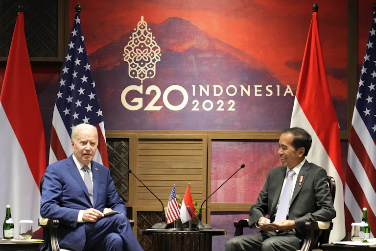 President Joe Biden (L) talks with Indonesian President Joko Widodo during their bilateral meeting ahead of the G20 Summit in Nusa Dua, Bali, Indonesia, 14 November 2022.