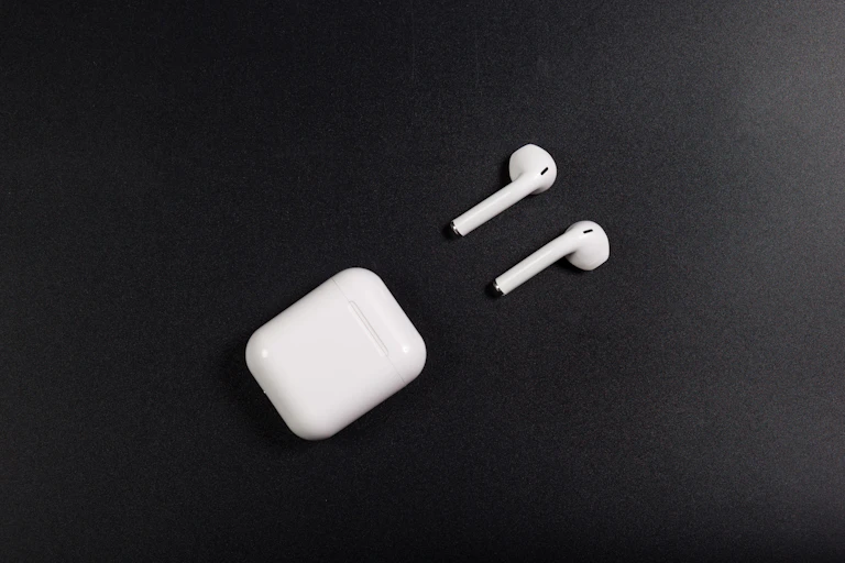 Wireless earbuds on black background
