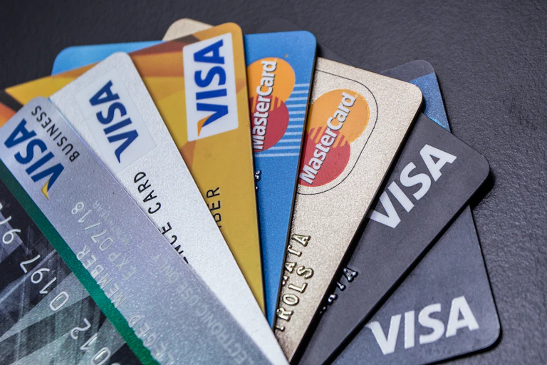 Credit cards fanned out on a black surface