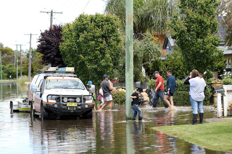 residents clean up after floods