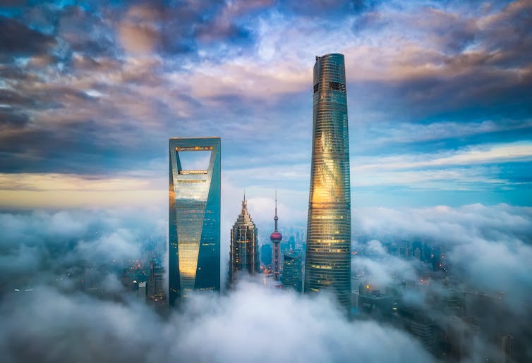 Skyscrapers emerging through clouds