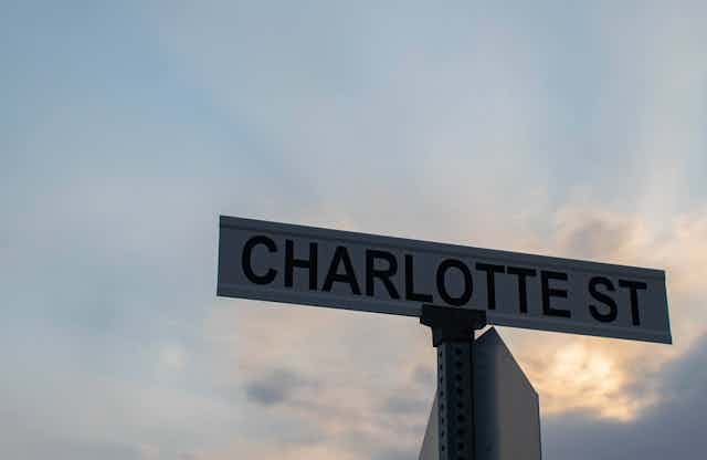 Street sign bearing the name "Charlotte St."