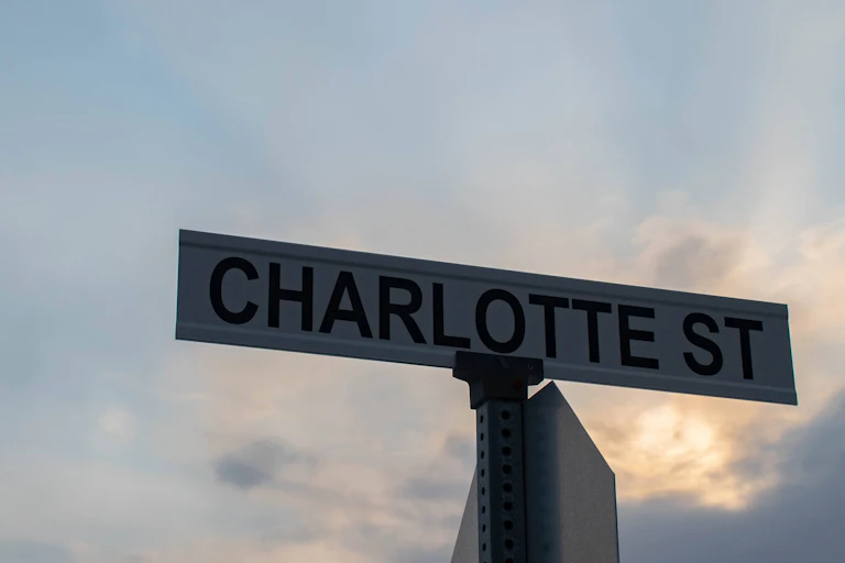 Street sign bearing the name "Charlotte St."