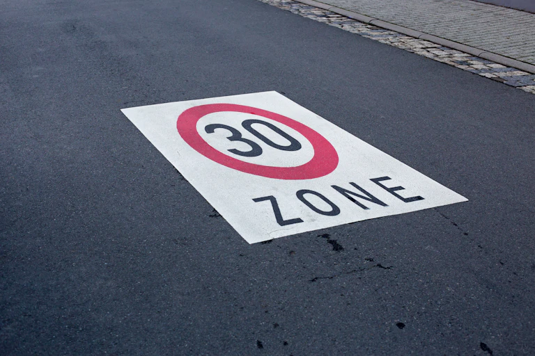 '30 Zone' sign on road