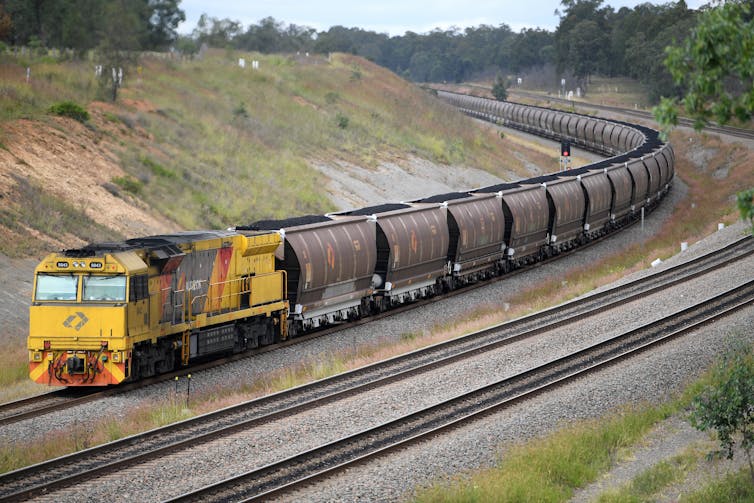 coal train rounds a bend