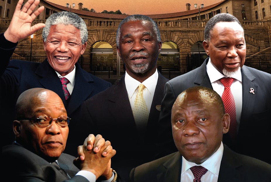 Five men wearing ties shows in front of the Union Buildings in Pretoria.