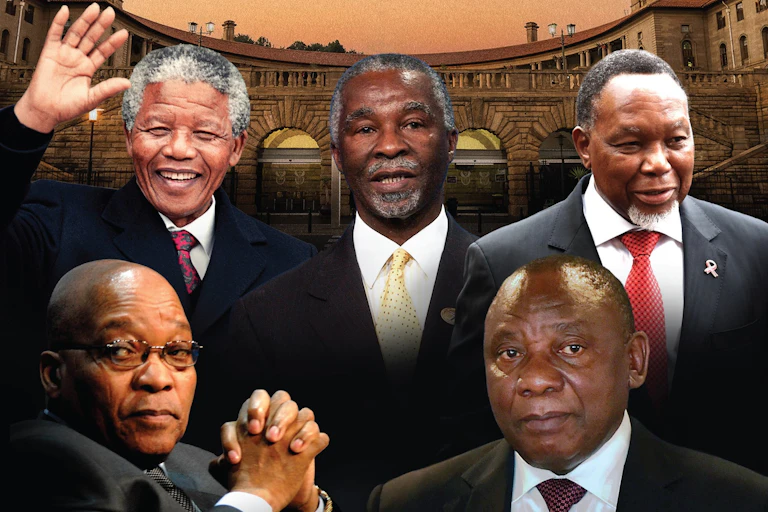 Five men wearing ties shows in front of the Union Buildings in Pretoria.