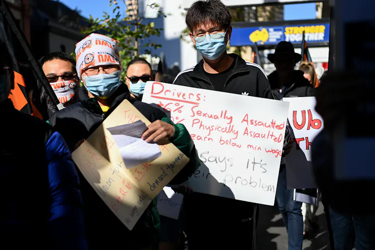 Demonstrators call for better treatment of food delivery workers in Sydney in May 2021.