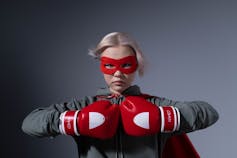 A teen in a superhero mask.